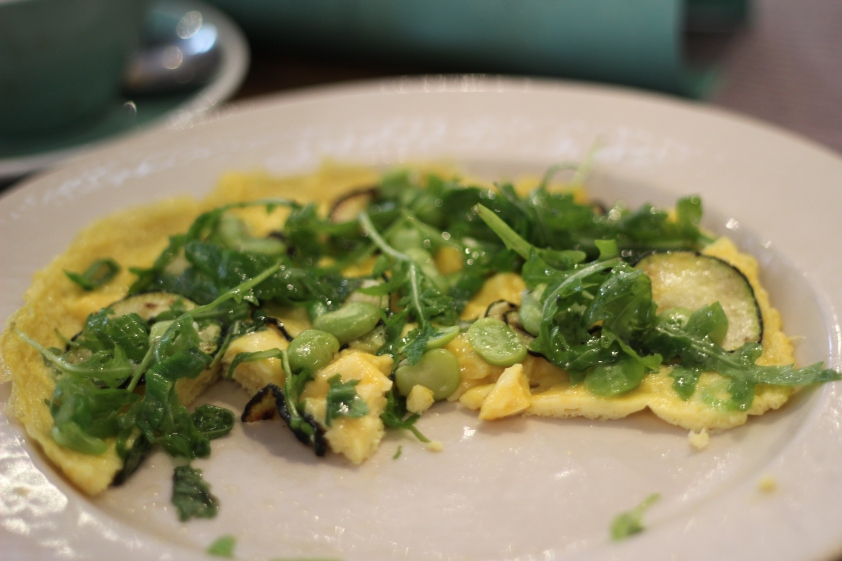 Omelette with rocket and broad beans and courgettes